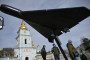 People look at an Iranian-designed HESA Shahed 136 (Geran-2) drone at an open-air exhibition of destroyed Russian military equipment on Mykhailivska Square in front of Saint Michael’s Golden-Domed Cathedral, in Kyiv, Ukraine. (Source: Getty Images)