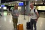 Russian nationals with luggage at Zvartnots International Airport in Yerevan, Armenia, amid increased arrivals from Russia.