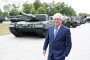 Armin Papperger, CEO of Rheinmetall AG, stands in front of a Leopard 2 A4 main battle tank during a visit to the Rheinmetall plant in Unterlüß, Lower Saxony, July 24, 2025. (Source: Getty Images)