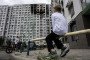 Boys look at a heavily damaged residential building following a Russian strike in Kyiv on September 1, 2026. Illustrative photo. (Source: Getty Images)