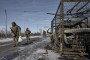 Ukrainian servicemen walk toward frontline positions near Kostyantynivka, Donetsk region, February 11, 2026. (Source: Getty Images)