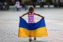 A girl with a Ukrainian flag. Illustrative image. (Source: Getty Images)