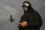 An employee of the Ukrainian SkyFall company conducts a test flight with a P1-Sun interceptor drone at an undisclosed location in Ukraine on March 19, 2026. (Source: Getty Images)