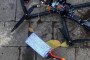Wreckage of a Russian FPV drone modified for mobile network control, with exposed electronics and battery components, found in Ukraine, October 2025. (Source: Serhii Flash)