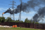 Dark smoke billows over power lines near Rosneft’s Komsomolsk oil refinery in Khabarovsk region following a major fire. (Source: OSINT channel Exilenova+)