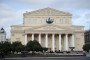 People pass by the Bolshoi Theatre in Moscow, on September 27, 2011. (Source: Getty Images)
