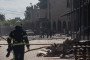 Firefighters and emergency services operate in the parking lot of a company following a Russian drone strike in the city of Sumy, northeastern Ukraine, on June 17, 2026. (Source: Getty Images)