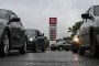 People queue to refuel their cars at a Lukoil petrol station. (Source: Getty Images)