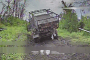 Russian BM-21 multiple-launch rocket system moments before Ukrainian FPV-drone strike, July 2026.