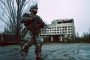 A Ukrainian soldier wearing a combat exoskeleton stands in the Chornobyl Exclusion Zone during field testing. (Photo: Open source)