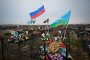 Flags of Russia and the country’s Airborne Troops fly above graves of Russian soldiers at a cemetery in the town of Yefremov in the Tula region on March 23, 2023.
