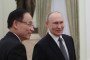 Russia's leader Vladimir Putin welcomes Vietnam's Foreign Minister Le Hoai Trung prior to their meeting in Moscow. (Source: Getty Images)