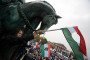 Participants gather with flags at the Millennium Monument at Heroes' Square in central Budapest during an event commemorating the 69th anniversary of the Hungarian uprising on October 23, 2025. (Source: Getty Images)