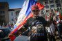 Man with t-shirt with Russian leader Vladimir Putin waves Russian flag during protest of nationalist and Russophile party of Vazrazhdane (Revival) in support of Russia. (Source: Getty Images)