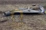 Wreckage of a Shahed-type drone lies in an open field, showing damage to the fuselage and tail section. (Source: Mines and Coffee with Sandwiches)