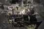 Local residents inspect cars burned in a Russian overnight missile and drone attack in Kyiv, Ukraine, on August 20, 2026. (Source: Getty Images)