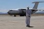 A man walks toward an Ilyushin Il-76 aircraft carrying supplies from the United Arab Emirates at the Port Sudan airport, on May 5, 2023.