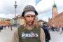 A protester is seen wearing a helmet and a vest with an inscription, reading “Press” covered in fake blood, to symbolize journalists who died due to the Russian full-scale invasion of Ukraine. (Source: Getty Images)