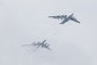 A Tupolev Tu-142 warplane (L) and Ilyushin Il-78 aerial refuelling tanker take part in a rehearsal of the upcoming Russian Navy Day military parade in St. Petersburg, Russia, on 30 July 2017. (Source: Getty Images)