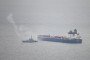 A border security vessel patrols the detained Smyrtos vessel outside the harbour, June 15, 2026, in Portland, England.