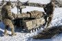 Soldiers demonstrate how the Tencore Unmanned Ground Vehicle (UGV) TerMIT is used for evacuation procedures during a demonstration on February 20, 2026 in Kyiv Region, Ukraine. (Source: Getty Images)