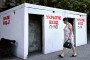 A woman walks past a bomb shelter in Sevastopol, the main base for Russia’s Black Sea Fleet, in the Crimean peninsula, on July 22, 2026.