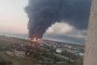 A massive plume of smoke rises above fuel infrastructure in occupied Kerch following a reported drone strike on June 21, 2026. (Photo: Open source)