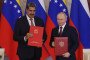Venezuelan President Nicolas Maduro exchanges documents with Russian leader Vladimir Putin on May 7, 2025 in Moscow, Russia. (Source: Getty Images)