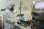 A lab technician wearing personal protective equipment (PPE) inspects a chemical reactor containing vaccine material at the Gamaleya National Research Center in Moscow, Russia, on August 6, 2020.