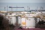 Oil storage tanks stand at the RN-Tuapsinsky refinery, operated by Rosneft Oil Co., as a tanker sails beyond in Tuapse, Russia. (Source: Getty Images)