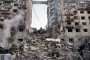 Ukrainian rescuers conduct a search and rescue work in a heavily damaged residential building following the Russian missile strike in Kyiv on June 17, 2025.