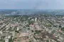 Aerial view of Oleshky, Kherson region, with smoke rising over parts of the city.