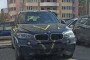 A civilian BMW X5 allegedly stolen by Russian forces from occupied Ukraine, marked with a military “V” in Belarus, April 2022. (Source: Motolko.help)