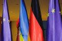 The Ukrainian flag is built up between the German flag and the flag of the European Union on December 15, 2025 in Berlin, Germany. (Source: Getty Images)