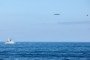 A Russian Tu-142 maritime patrol aircraft flies over the Norwegian Sea as a British Royal Navy warship and F-35B fighter monitor its movements on July 2, 2026. (Source: UK Ministry of Defence)