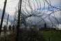 Tourists stand next to a razor-wire boundary fence along the Polish-Lithuanian border with the Russian exclave of Kaliningrad near the village of Grzybina, Podlaskie Voivodeship, near the Suwalki Gap on September 26, 2026. (Source: Getty Images)