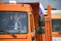 Russian leader Vladimir Putin drives a construction truck across the road-and-rail Crimean Bridge over the Kerch Strait linking mainland Russia to Moscow-annexed Crimea during the opening ceremony on May 15, 2018.