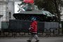 A child walks in front of a Russian T-34 tank WWII memorial in front of Crimea's regional parliament in Simferopol. (Source: Getty Images)