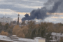 Thick black smoke rises over an industrial area in Omsk, Russia, following a reported Ukrainian drone strike on the Omsk Oil Refinery on October 8, 2026. (Source: Exilenova+)