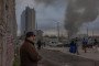 Smoke rises following a Russian strike, as residents observe the aftermath. (Source: Roman Pilipey/Instagram)