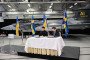 Swedish Prime Minister Ulf Kristersson and Ukrainian President Volodymyr Zelenskyy sign a letter of intent in front of a Gripen fighter jet in Linköping, Sweden, on October 22, 2025. (Source: Getty Images)