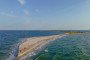 Visitors walk along the narrow shoreline of the Kinburn Spit, a remote sandbar between the Black Sea and the Dnipro-Buh estuary in southern Ukraine. (Photo: Open source)