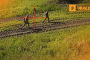 Two Russian soldiers cross an open field under a targeting reticle during Ukraine’s 3rd Army Corps Operation Vivaldi. (Source: 3rd Army Corps)