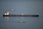 Military ships patrol the Smyrtos vessel outside the harbour, on June 14, 2026 in Portland, England. An oil tanker operating as part of Russia’s shadow fleet has been intercepted by British Forces in the English Channel. (Source: Getty Images)