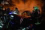 Firefighters extinguish burning civilian vehicles in Kyiv following an overnight Russian drone and missile attack on September 24. (Source: Kyiv State Emergency Service)