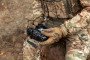 A soldier remotely controls a drone. Control panel in military hands. (Source: Getty Images)