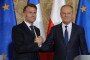 French President Emmanuel Macron (L) and Polish Prime Minister Donald Tusk shake hands at the end of a joint press conference at the Main Town Hall in Gdansk, Poland, on April 20, 2026. (Source: Getty Images)