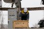 An employee of DTEK Odesa Electric Networks carries out emergency repair work at a substation damaged by Russian shelling in Odesa, Ukraine. (Source: Getty Images)