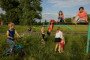 Children play near a public football field in the village in the Dnipropetrovsk region on June 25, 2025. Illustrative photo. (Source: Getty Images)