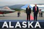 Russian leader Vladimir Putin and US President Donald Trump pose on a podium on the tarmac after arrival at Joint Base Elmendorf-Richardson in Anchorage, Alaska, on August 15, 2025. (Source: Getty Images)